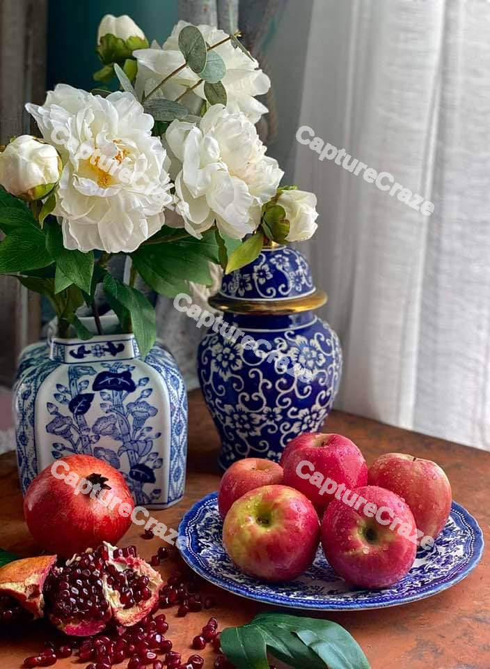 Red apples on a blue plate